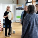 People in a speech therapy group standing in a circle