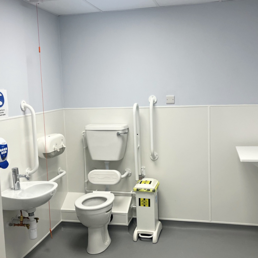 A toilet in a hospital